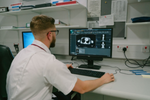 Radiographer looking at breast images